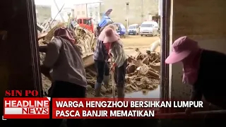Warga Hengzhou Bersihkan Lumpur Pasca Banjir Mematikan