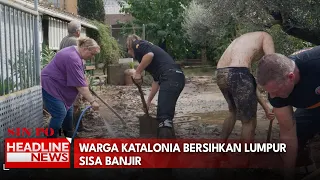 Warga Katalonia Bersihkan Lumpur Sisa Banjir